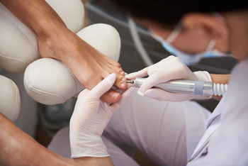 pedicure using electric nail drill